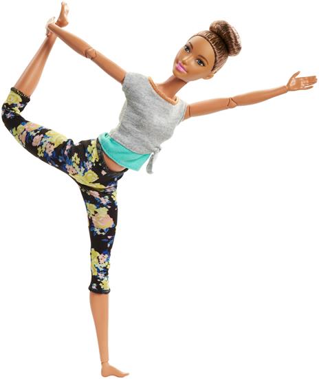 Barbie. Bambola con 22 Punti Snodabili con Chignon e Abiti da Yoga. Multicolore