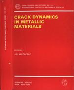 Crack dynamics in metallic materials