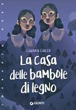 La casa delle bambole di legno