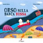 Orso sulla barca rossa